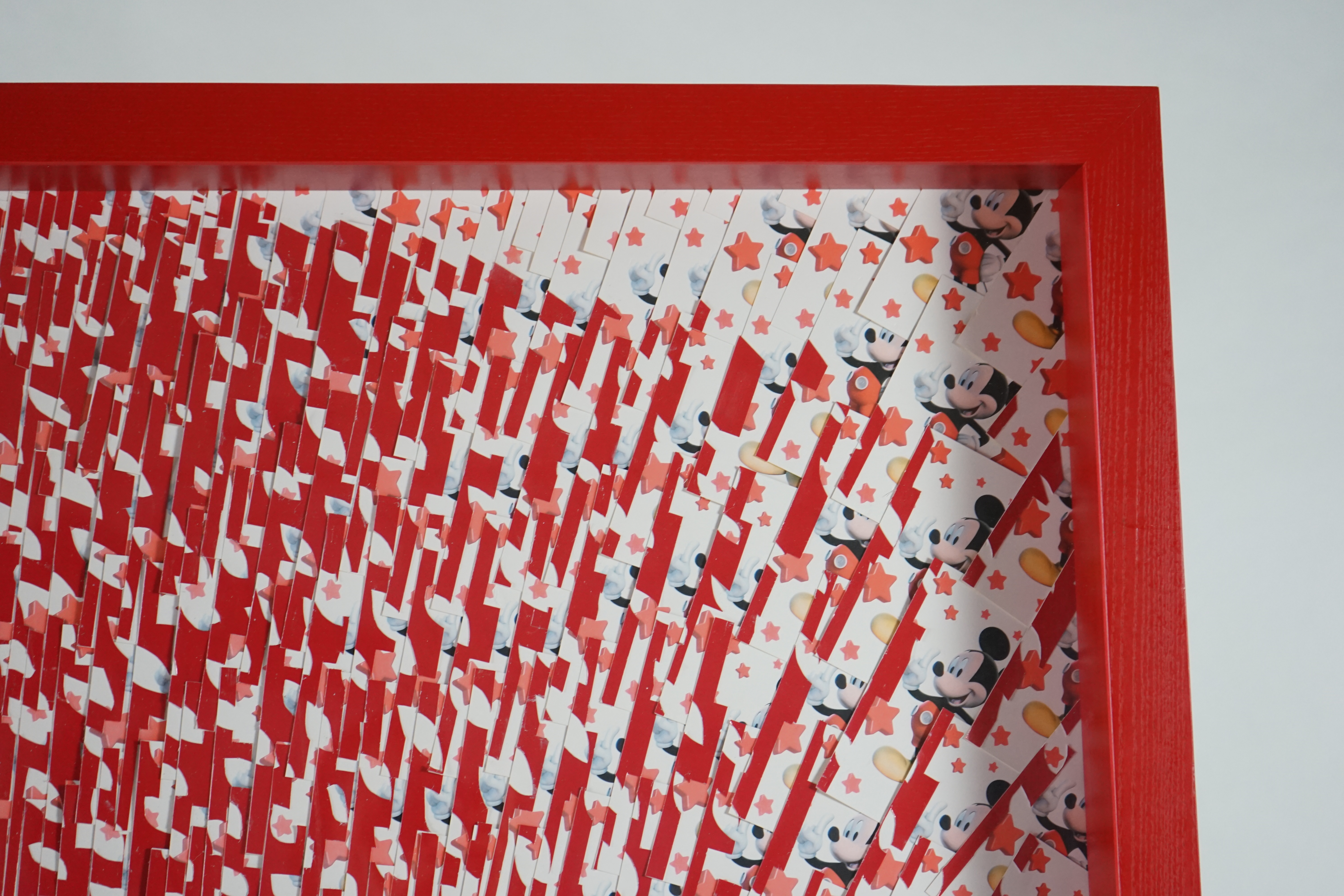 David Mach (Scottish, b.1956), Che Guevara, collage of cutout segments of postcards of Mickey Mouse, 181 x 181cm